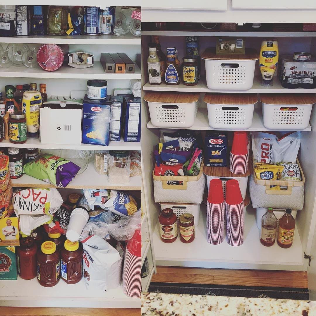 A white pantry shelf filled with various food items and white plastic storage baskets.