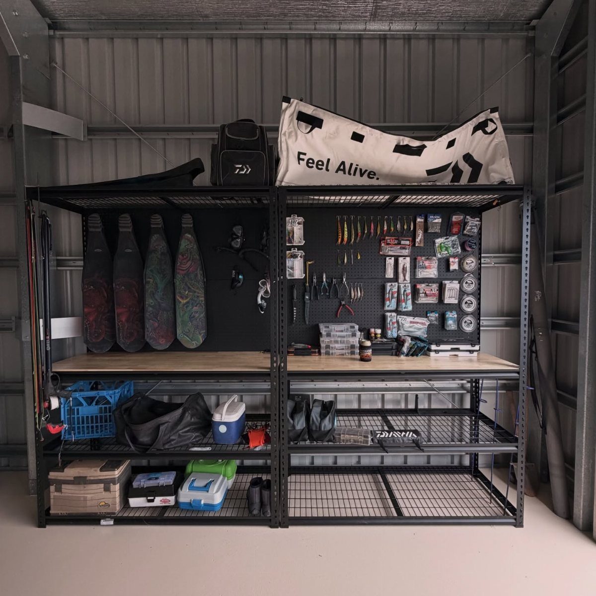 14 Shed Organization Ideas for a Tidy, Functional Space 4 Black metal shelving unit with a workbench, pegboard tools, and various storage bins in a garage.