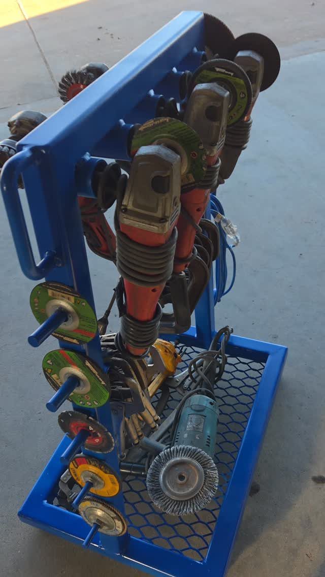 13 Shop Tool Storage Ideas for Pegboard, Carts and Cabinets 13 Blue metal storage rack holding several angle grinders and various grinding discs on concrete.