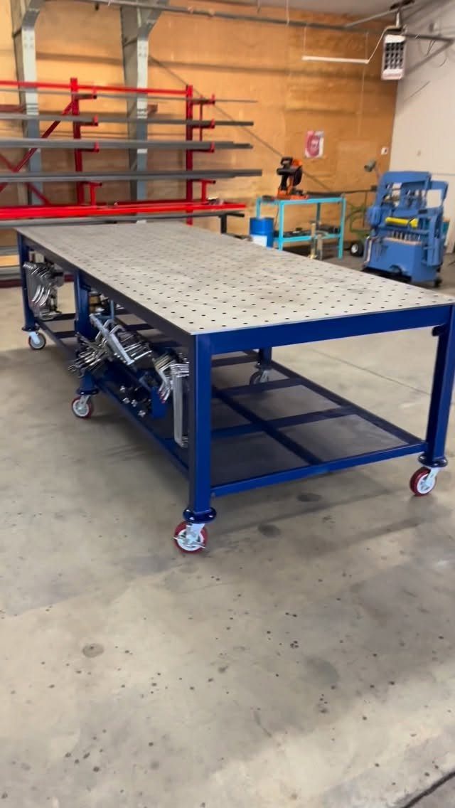 13 Shop Tool Storage Ideas for Pegboard, Carts and Cabinets 3 A blue metal workbench with a perforated top and integrated tool storage on wheels.
