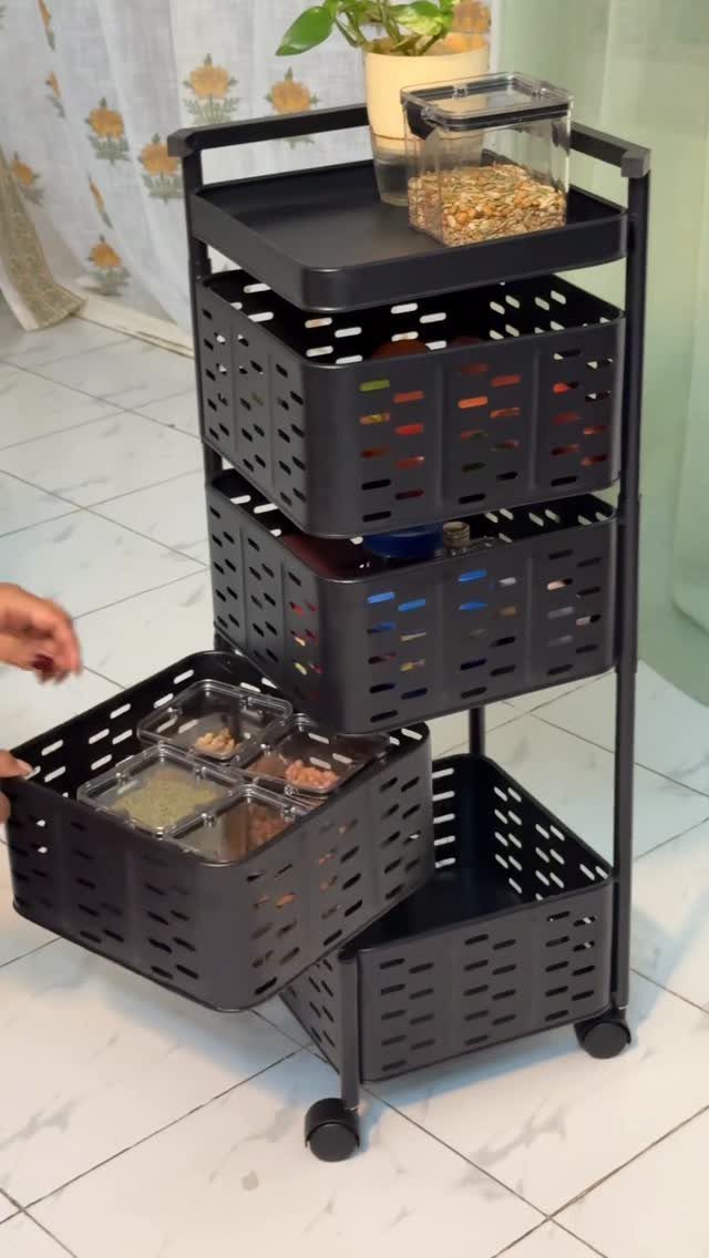 12 Storage Ideas for Small Homes to Add Extra Space Fast 11 A black rolling utility cart with four storage baskets on a tiled floor.