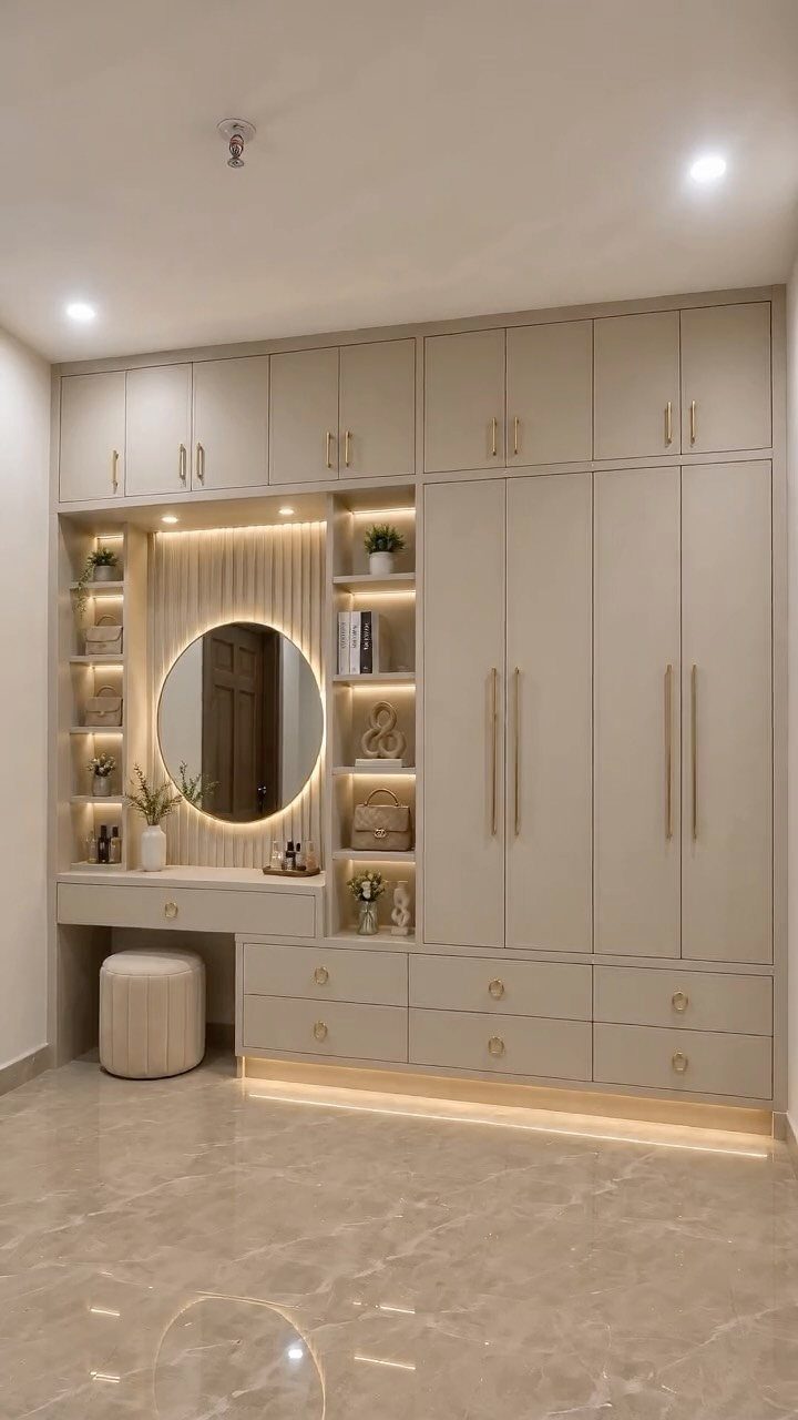 14 Wardrobe Interior Design Ideas for Every Bedroom 5 Built-in beige wardrobe system featuring an integrated dressing table with a backlit circular mirror.
